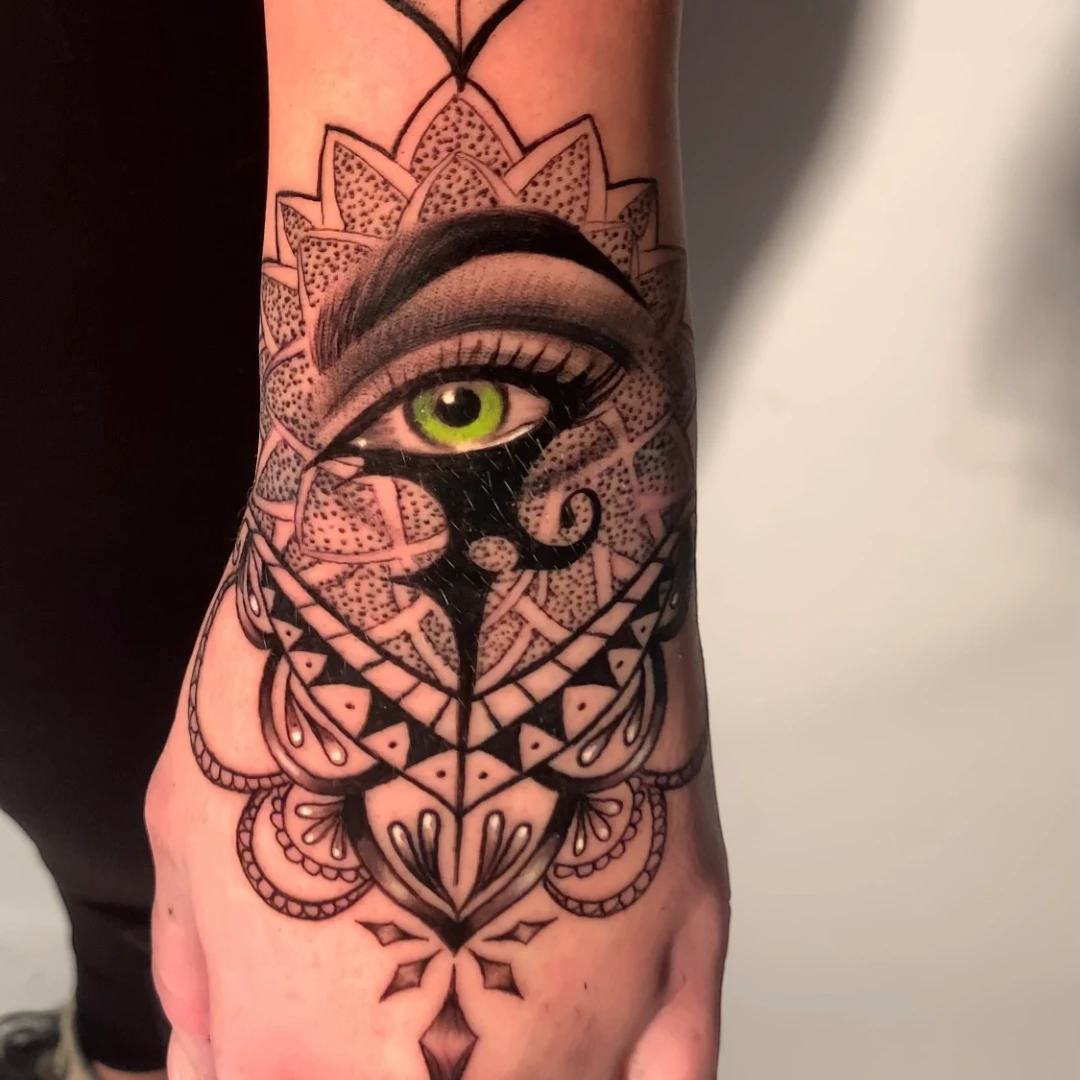 Black and grey mandala hand tattoo by Vegas Vic